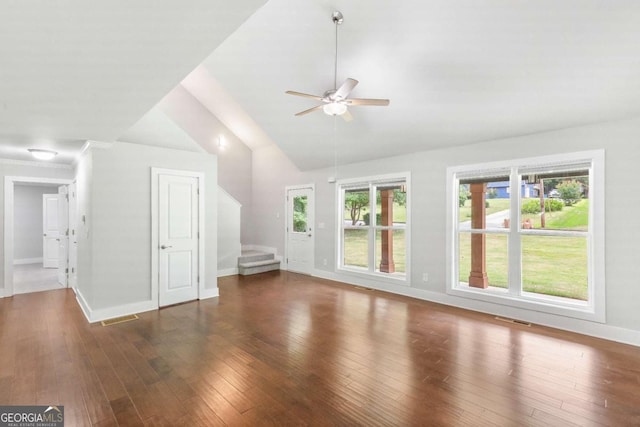 347 Chip Rd, Stone Mountain, GA 30087 - unfurnished living room with lofted ceiling, a ceiling fan, stairway, wood-type flooring, and baseboards