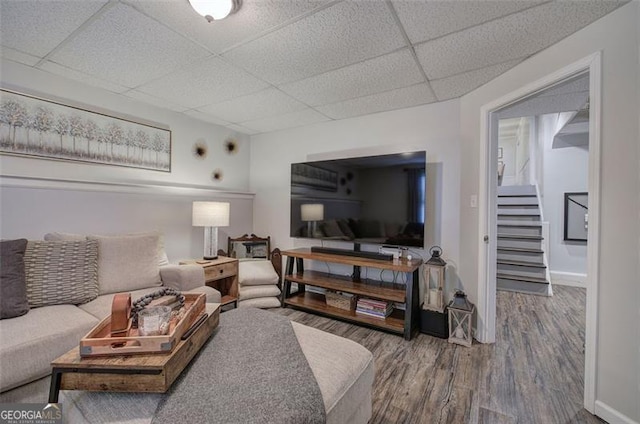 123 Mill Ln, Dallas, GA 30157 - living area with a drop ceiling, stairway, wood finished floors, and baseboards