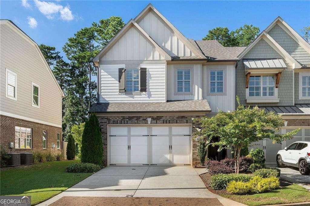 4137 Avid Park, Marietta, GA 30062 - view of front of property featuring board and batten siding, central air condition unit, concrete driveway, and stone siding