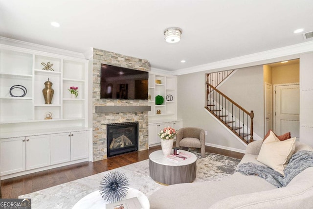 667 Creswell Park, Smyrna, GA 30082 - living room featuring stairway, dark wood finished floors, crown molding, a stone fireplace, and baseboards