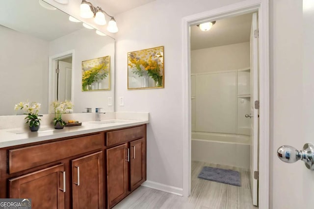 667 Creswell Park, Smyrna, GA 30082 - full bathroom with vanity, baseboards, and shower / tub combination