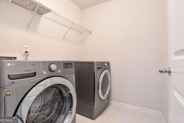 667 Creswell Park, Smyrna, GA 30082 - washroom with washer and clothes dryer and baseboards