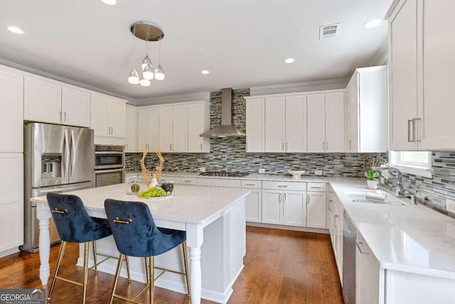 667 Creswell Park, Smyrna, GA 30082 - kitchen featuring stainless steel appliances, wall chimney exhaust hood, a sink, dark wood-type flooring, and white cabinets