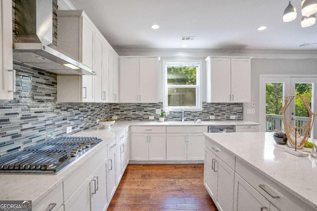 667 Creswell Park, Smyrna, GA 30082 - kitchen with wall chimney range hood, appliances with stainless steel finishes, a sink, white cabinetry, and tasteful backsplash