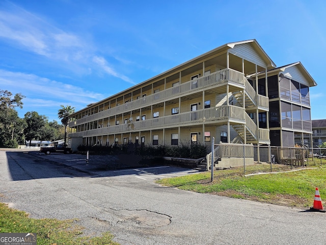127 Azalea Rd Apt A103, Midway, GA 31320 - view of apartment building / complex featuring uncovered parking and stairway