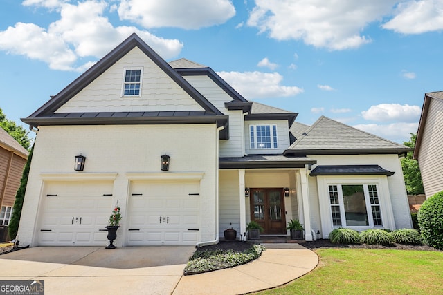 12645 Morningpark Cir, Alpharetta, GA 30004 - view of front facade featuring french doors, driveway, brick siding, an attached garage, and a shingled roof