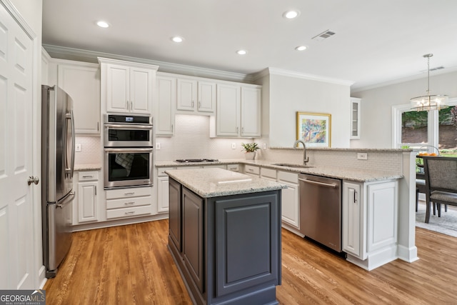 12645 Morningpark Cir, Alpharetta, GA 30004 - kitchen featuring stainless steel appliances, a sink, white cabinets, ornamental molding, and tasteful backsplash