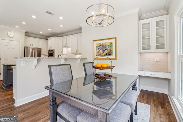 12645 Morningpark Cir, Alpharetta, GA 30004 - dining area with ornamental molding, a chandelier, dark wood-style flooring, recessed lighting, and baseboards