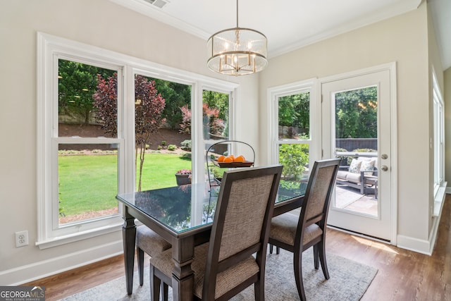12645 Morningpark Cir, Alpharetta, GA 30004 - dining space with a chandelier, ornamental molding, baseboards, and wood finished floors