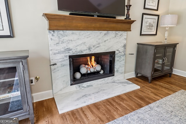12645 Morningpark Cir, Alpharetta, GA 30004 - detailed view of a high end fireplace, baseboards, and wood finished floors