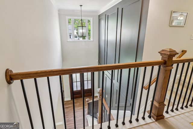 12645 Morningpark Cir, Alpharetta, GA 30004 - stairs with ornamental molding, a chandelier, and wood finished floors