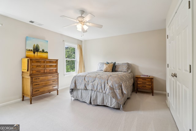 12645 Morningpark Cir, Alpharetta, GA 30004 - bedroom featuring light colored carpet, a closet, and baseboards