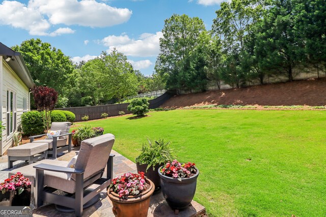 12645 Morningpark Cir, Alpharetta, GA 30004 - view of yard featuring a patio area and an outdoor living space