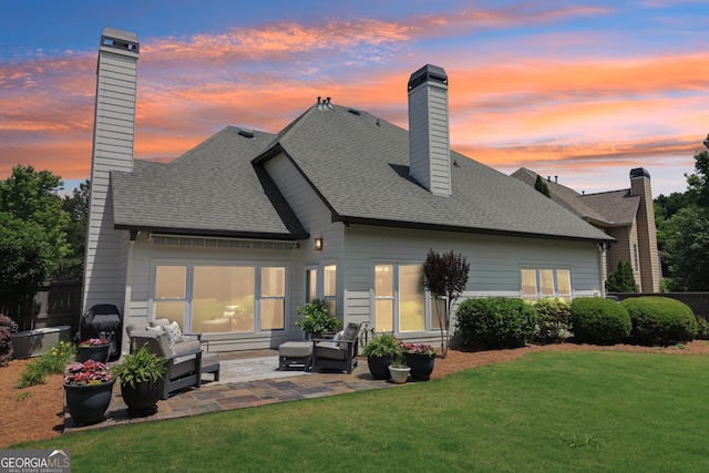 12645 Morningpark Cir, Alpharetta, GA 30004 - rear view of house with a chimney, an outdoor hangout area, a yard, and a patio area