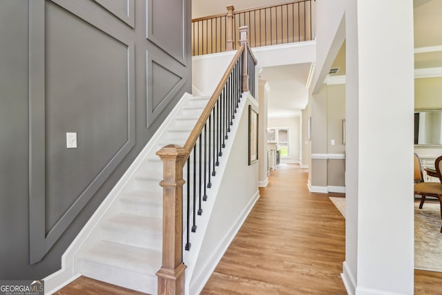 12645 Morningpark Cir, Alpharetta, GA 30004 - stairway featuring wood finished floors, baseboards, and ornamental molding