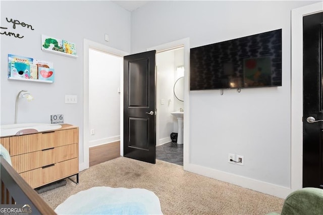 1195 Milton Ter SE Unit 5101, Atlanta, GA 30315 - carpeted bedroom with baseboards and ensuite bath