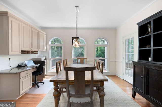 206 Kingsley Way, Woodstock, GA 30188 - dining area with light wood finished floors and ornamental molding