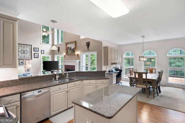206 Kingsley Way, Woodstock, GA 30188 - kitchen with dishwasher, a sink, a fireplace, a ceiling fan, and healthy amount of natural light