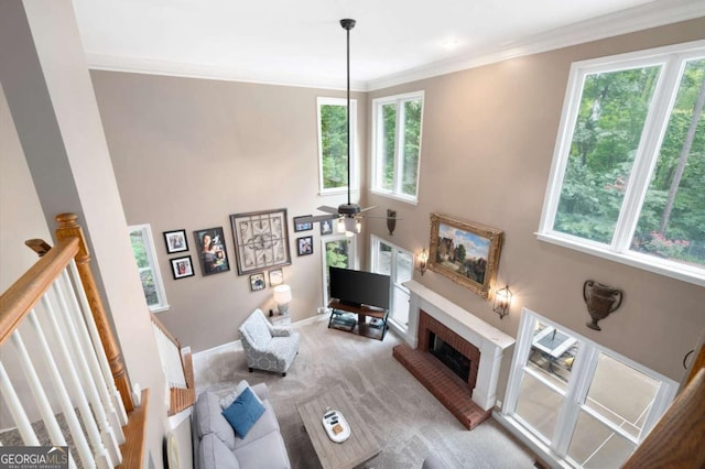 206 Kingsley Way, Woodstock, GA 30188 - living room with healthy amount of natural light, carpet, a fireplace, crown molding, and baseboards