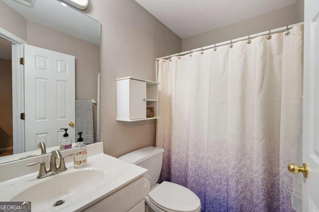 206 Kingsley Way, Woodstock, GA 30188 - bathroom featuring toilet, vanity, and a shower with curtain