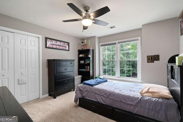 206 Kingsley Way, Woodstock, GA 30188 - bedroom with light colored carpet, a closet, a ceiling fan, and baseboards