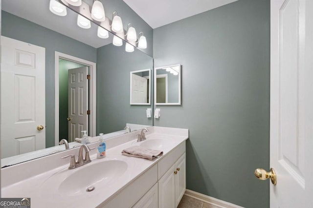 206 Kingsley Way, Woodstock, GA 30188 - bathroom with double vanity, tile patterned floors, and baseboards