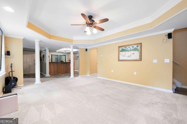 206 Kingsley Way, Woodstock, GA 30188 - unfurnished living room featuring ornate columns, a raised ceiling, crown molding, light carpet, and ceiling fan