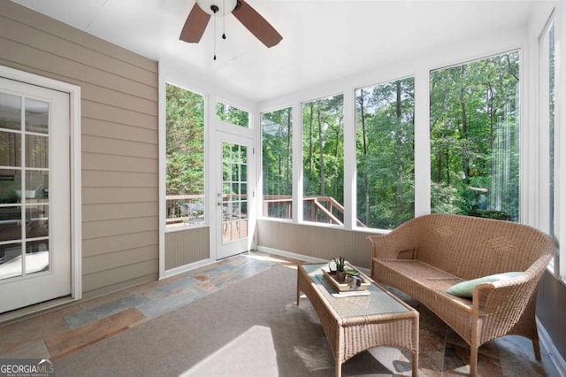 206 Kingsley Way, Woodstock, GA 30188 - sunroom / solarium featuring stone tile flooring, ceiling fan, wood walls, an outdoor hangout area, and french doors