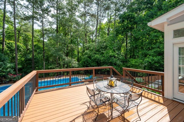 206 Kingsley Way, Woodstock, GA 30188 - wooden terrace with outdoor dining area