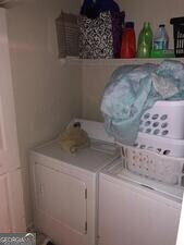 5658 Wind Gate Ln, Lithonia, GA 30058 - laundry area with washing machine and dryer