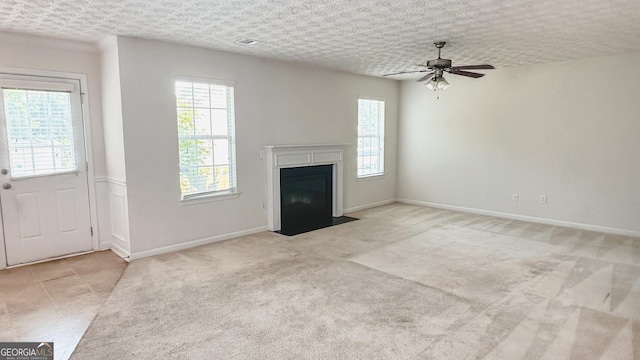 4676 Shaded Oak Ln, Forest Park, GA 30297 - unfurnished living room with ceiling fan, a fireplace with flush hearth, baseboards, and carpet flooring
