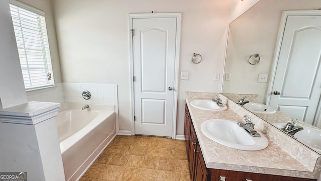 4676 Shaded Oak Ln, Forest Park, GA 30297 - full bathroom featuring double vanity and a garden tub