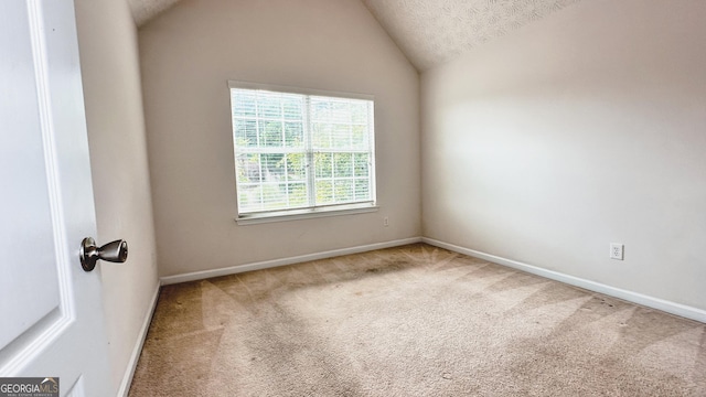 4676 Shaded Oak Ln, Forest Park, GA 30297 - carpeted empty room featuring lofted ceiling and baseboards