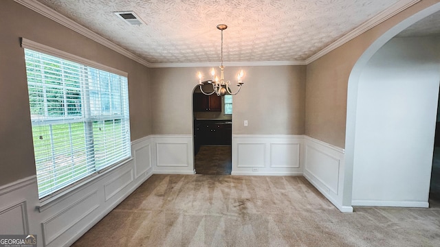 4676 Shaded Oak Ln, Forest Park, GA 30297 - unfurnished dining area with arched walkways, a chandelier, a wainscoted wall, and light carpet