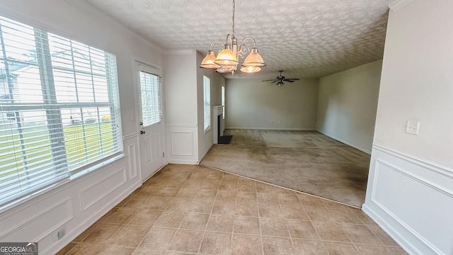 4676 Shaded Oak Ln, Forest Park, GA 30297 - unfurnished dining area with a chandelier, light carpet, light tile patterned floors, a ceiling fan, and a decorative wall