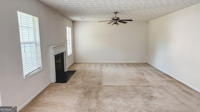 4676 Shaded Oak Ln, Forest Park, GA 30297 - unfurnished living room featuring a ceiling fan, a fireplace, carpet, and baseboards