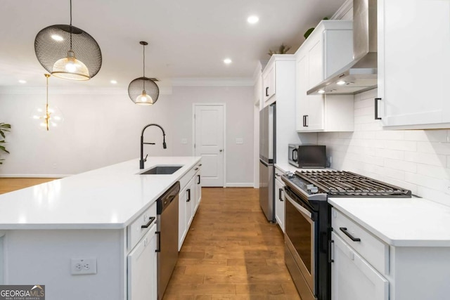 1227 Herty Dr, Marietta, GA 30062 - kitchen featuring appliances with stainless steel finishes, wall chimney exhaust hood, a sink, ornamental molding, and decorative backsplash