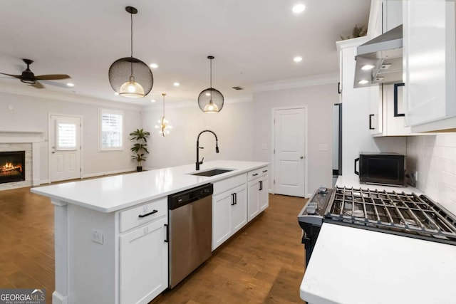 1227 Herty Dr, Marietta, GA 30062 - kitchen featuring dishwasher, a sink, ornamental molding, a kitchen island with sink, and ceiling fan