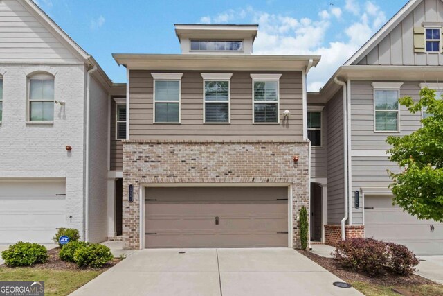 1227 Herty Dr, Marietta, GA 30062 - multi unit property featuring brick siding, driveway, and a garage