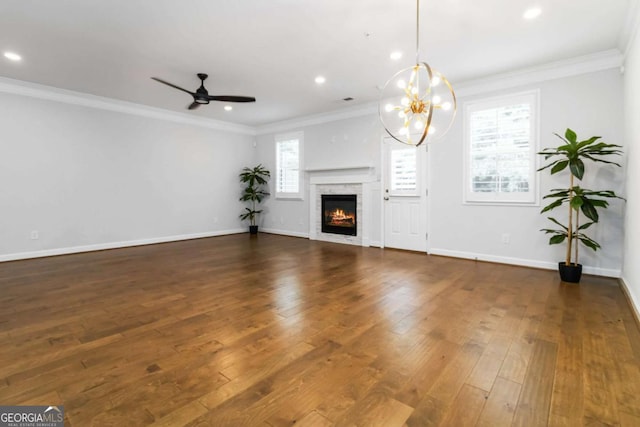 1227 Herty Dr, Marietta, GA 30062 - unfurnished living room featuring hardwood / wood-style flooring, ornamental molding, a warm lit fireplace, recessed lighting, and baseboards
