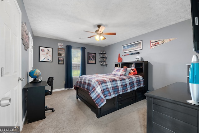 1195 New Hope Rd, Locust Grove, GA 30248 - carpeted bedroom featuring an office area, ceiling fan, a textured ceiling, and baseboards