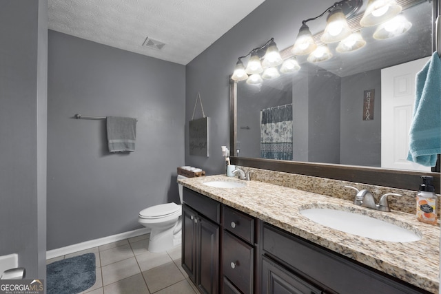 1195 New Hope Rd, Locust Grove, GA 30248 - bathroom featuring toilet, double vanity, tile patterned floors, a shower with shower curtain, and baseboards