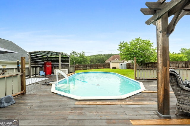 1195 New Hope Rd, Locust Grove, GA 30248 - view of swimming pool featuring a fenced backyard and a wooden deck