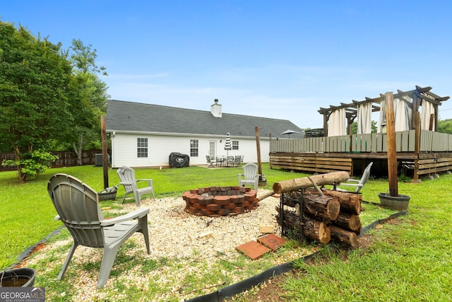1195 New Hope Rd, Locust Grove, GA 30248 - view of yard with an outdoor fire pit and a wooden deck