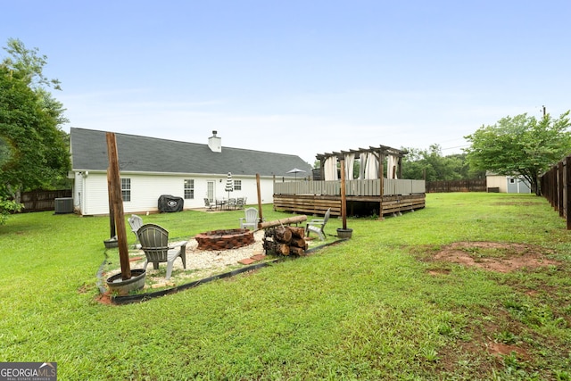 1195 New Hope Rd, Locust Grove, GA 30248 - view of yard with an outdoor fire pit, a deck, central AC unit, and a pergola