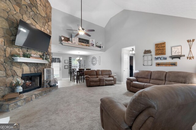 1195 New Hope Rd, Locust Grove, GA 30248 - living area featuring carpet, ceiling fan, a stone fireplace, high vaulted ceiling, and baseboards
