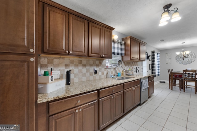 1195 New Hope Rd, Locust Grove, GA 30248 - kitchen with a sink, light tile patterned flooring, backsplash, and a chandelier