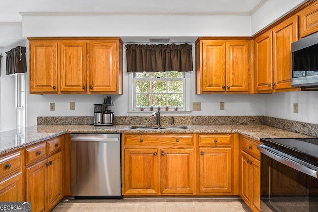 4506 Westcliff Trce NE, Roswell, GA 30075 - kitchen with appliances with stainless steel finishes, brown cabinets, light stone countertops, and ornamental molding