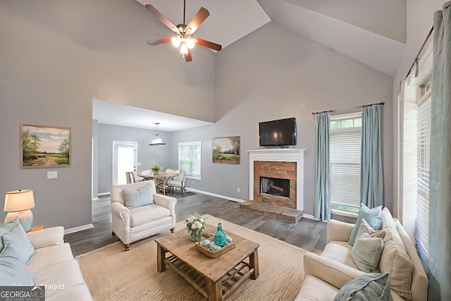36 Laurel Way NE, White, GA 30184 - living area featuring ceiling fan, dark wood finished floors, high vaulted ceiling, a fireplace, and baseboards