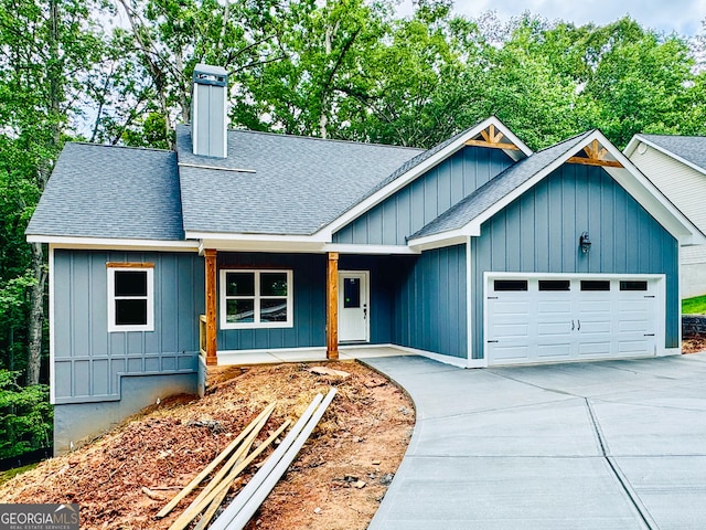 169 View St, Clarkesville, GA 30523 - view of front of house featuring roof with shingles, a garage, concrete driveway, and board and batten siding